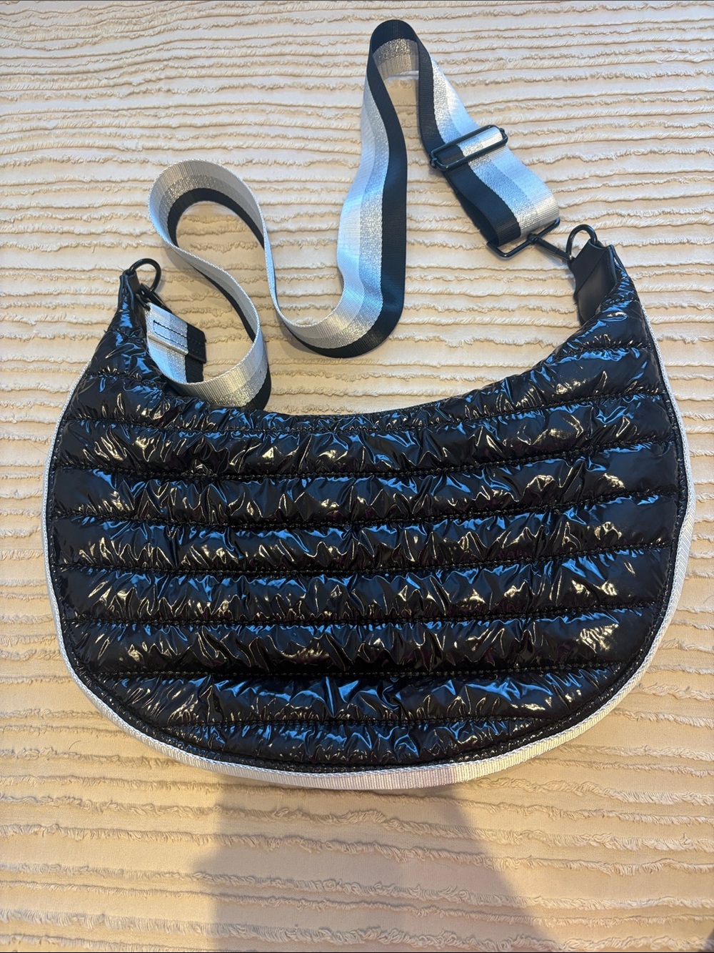 BCBGeneration Quilted Crescent Crossbody Bag in Black with Striped Strap